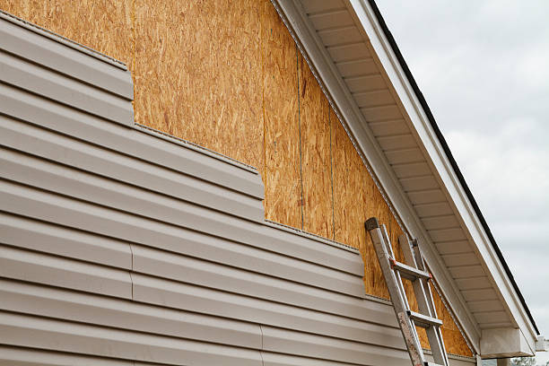 Professional Storm Damage Siding Repair technician working in Hyde Park, PA